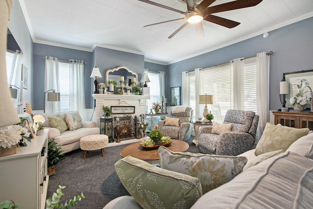 living room featuring ceiling fan, ornamental molding, and carpet floors