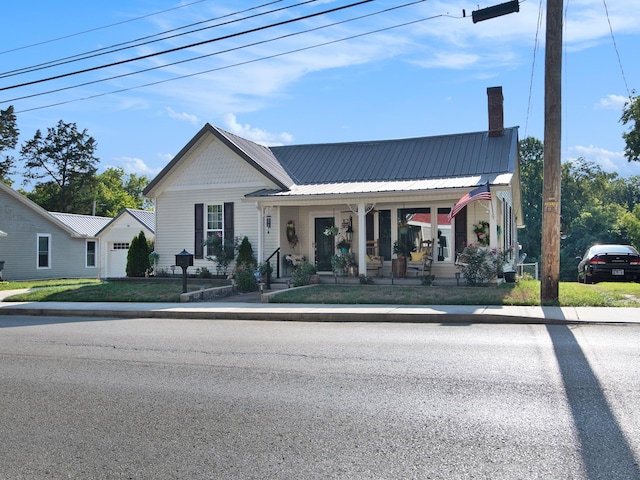 view of front of home with a porch and a front yard