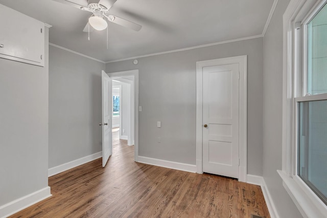 unfurnished room featuring crown molding, ceiling fan, and wood-type flooring