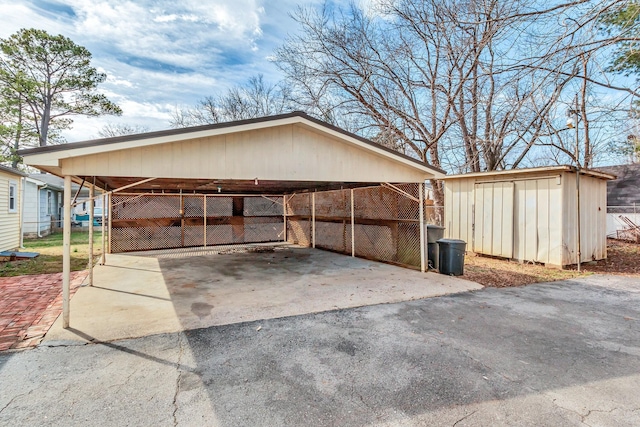 exterior space with a carport and a storage unit