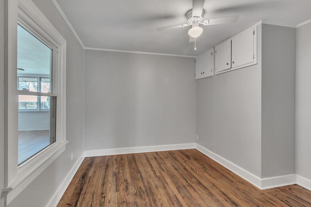 unfurnished room with ornamental molding, hardwood / wood-style floors, and ceiling fan