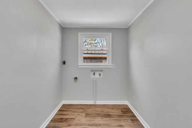 laundry room featuring ornamental molding, hookup for an electric dryer, washer hookup, and light hardwood / wood-style floors