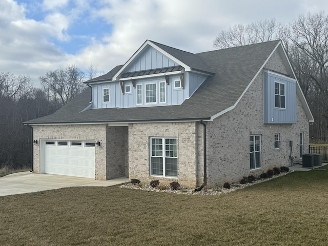 view of front of property featuring a garage and a front lawn