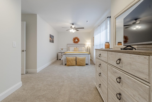 bedroom with light colored carpet and ceiling fan