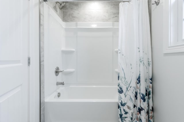 bathroom featuring shower / bath combo with shower curtain