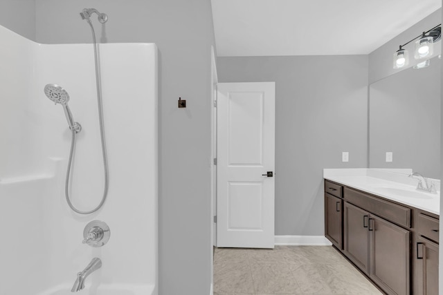 bathroom featuring vanity and tub / shower combination