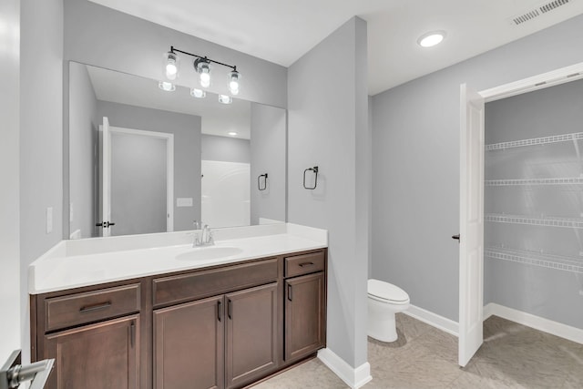 bathroom with vanity and toilet