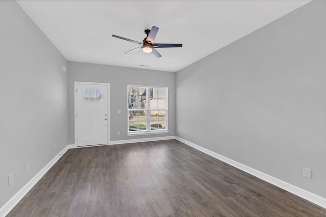 unfurnished room with dark hardwood / wood-style floors and ceiling fan