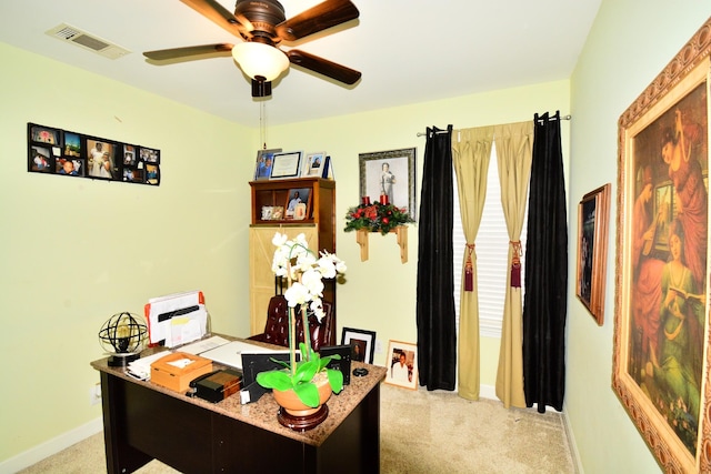 carpeted office featuring ceiling fan