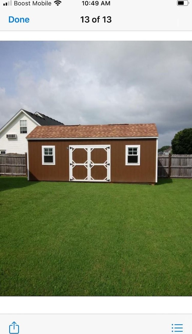 view of outdoor structure with a yard