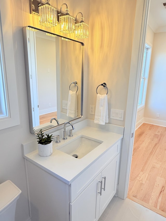 bathroom with vanity and hardwood / wood-style floors