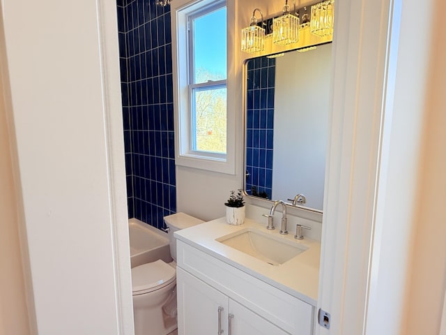 full bathroom featuring vanity, tub / shower combination, and toilet