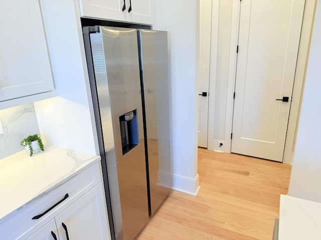 interior space with hardwood / wood-style flooring and vanity