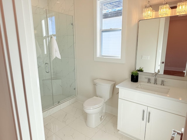 bathroom featuring vanity, plenty of natural light, toilet, and walk in shower