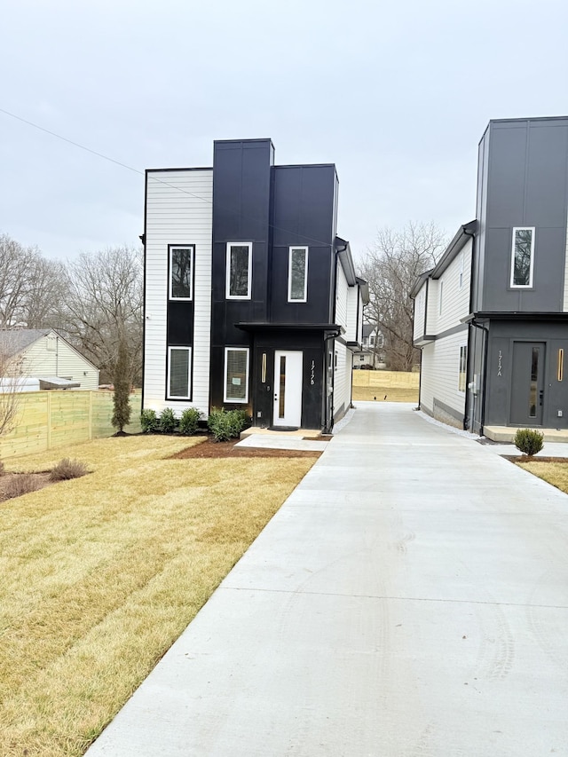 contemporary home with a front yard