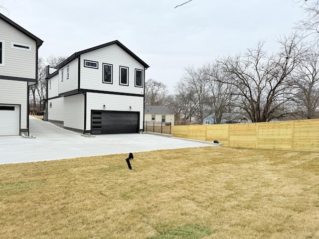 view of home's exterior featuring a garage and a yard