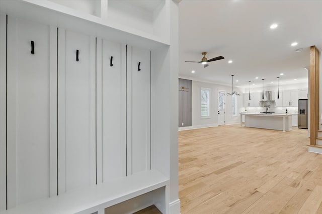 mudroom featuring recessed lighting, a sink, a ceiling fan, baseboards, and light wood-type flooring