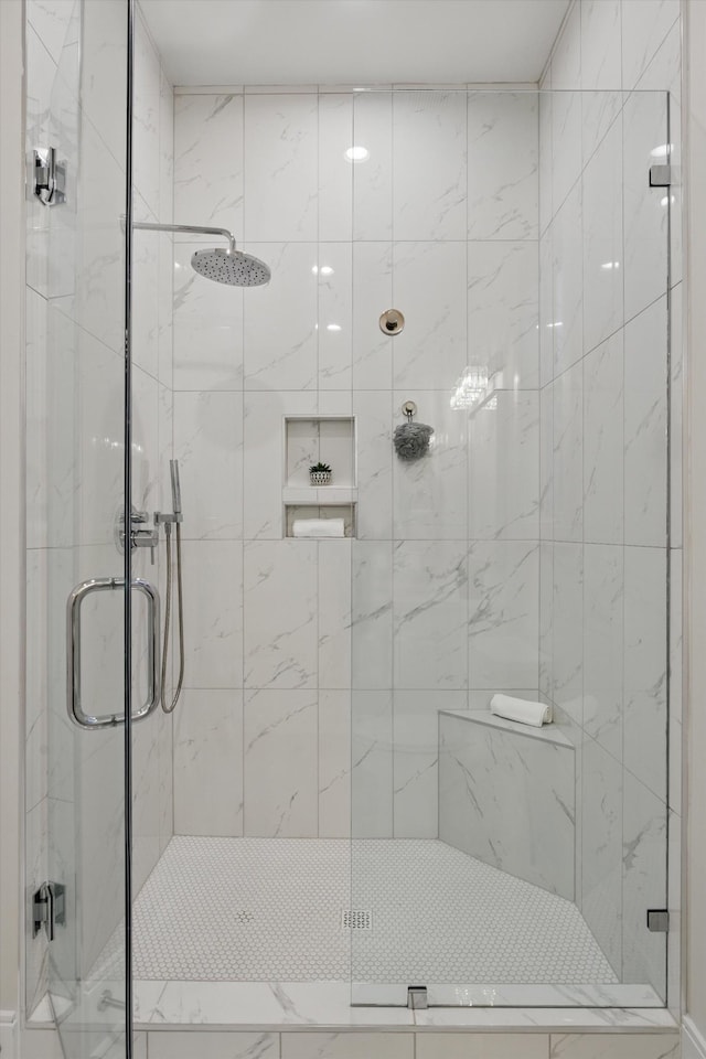 full bath with a shower stall