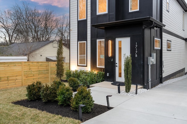 exterior entry at dusk with fence