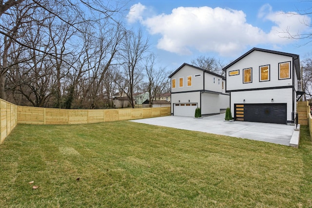 exterior space featuring driveway, an attached garage, and fence