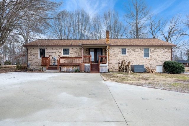 back of house with central AC