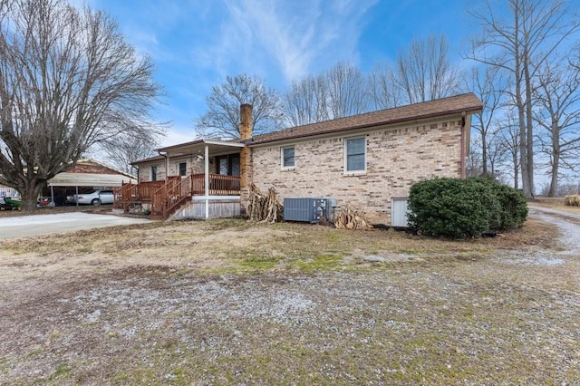 exterior space with central AC and covered porch