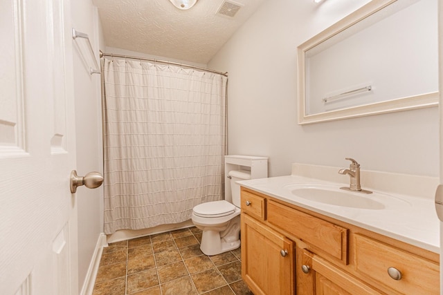 bathroom with a shower with curtain, vanity, a textured ceiling, and toilet