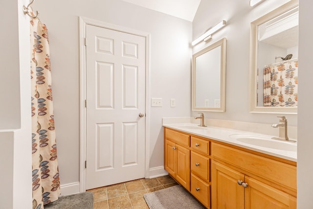 bathroom featuring tile patterned flooring and vanity