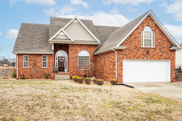 view of front property featuring a garage and a front lawn