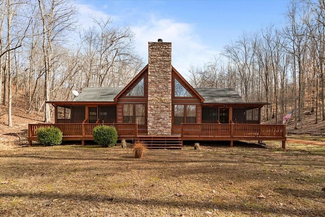 back of house with a wooden deck