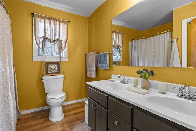 bathroom with vanity, hardwood / wood-style floors, a shower with curtain, and toilet