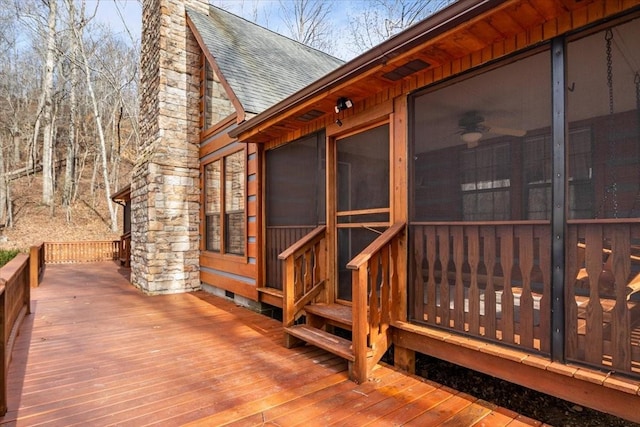 deck with a sunroom