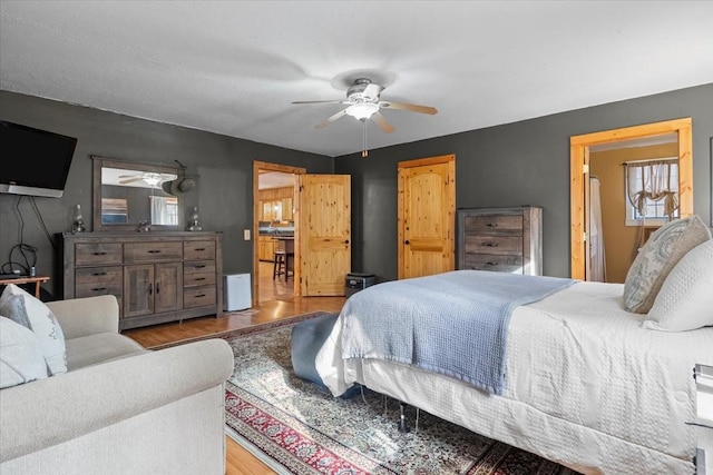 bedroom featuring wood-type flooring and ceiling fan