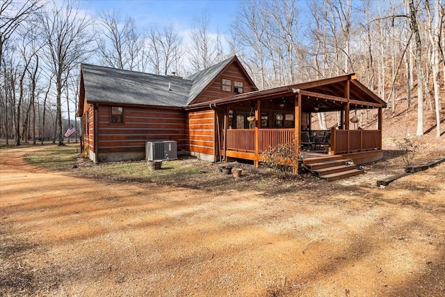 exterior space with central AC and a porch