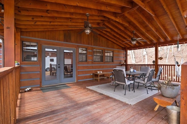 deck with french doors and ceiling fan