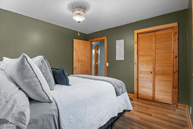 bedroom featuring light hardwood / wood-style floors and a closet