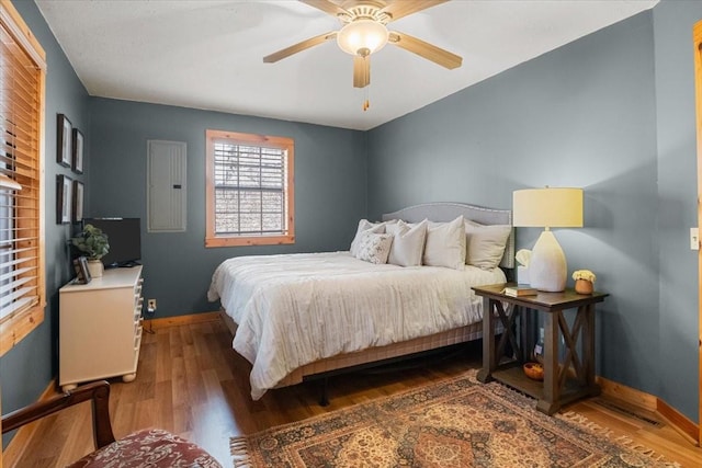 bedroom featuring ceiling fan and dark hardwood / wood-style flooring