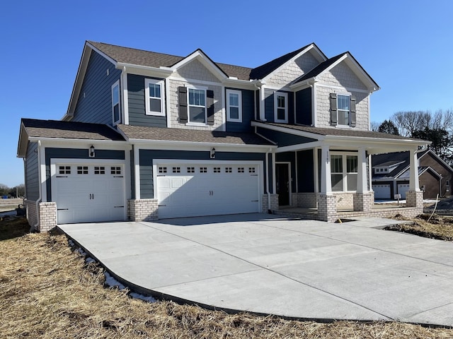 craftsman house with a garage