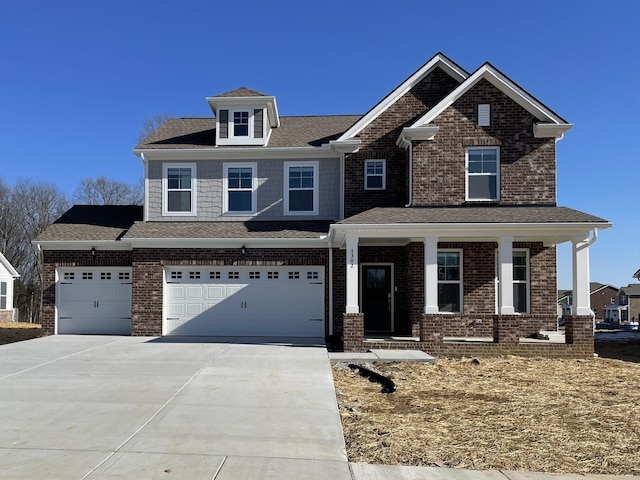 craftsman house with a garage and covered porch