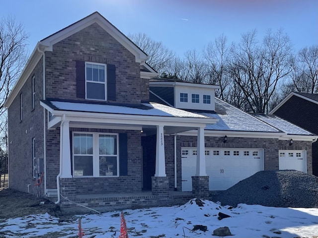 view of front of property with a garage and covered porch