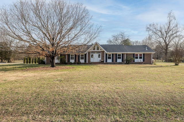 ranch-style home featuring a front yard