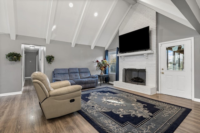 living room featuring a fireplace, high vaulted ceiling, beam ceiling, and hardwood / wood-style floors