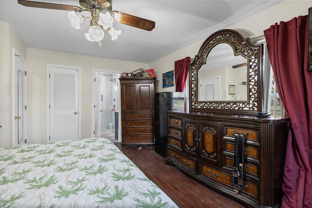 bedroom featuring dark wood-type flooring and connected bathroom