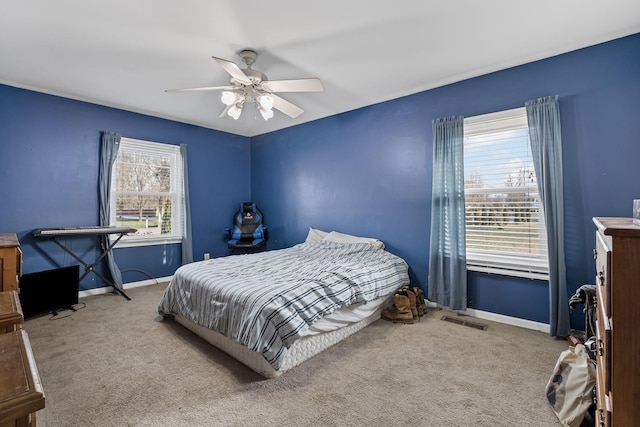 carpeted bedroom featuring ceiling fan