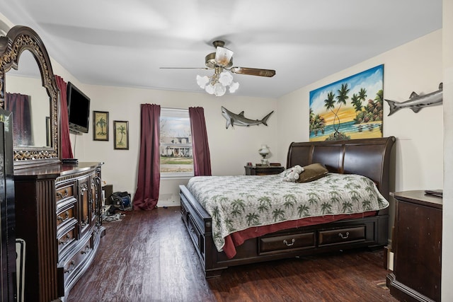 bedroom with ceiling fan and dark wood-type flooring