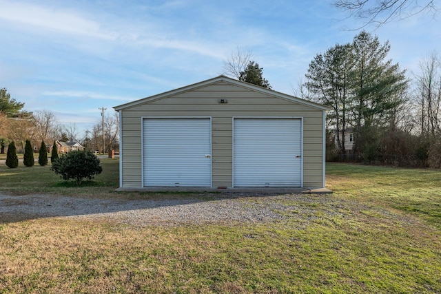 garage featuring a yard