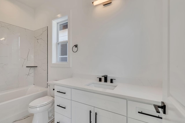 full bathroom with vanity, tiled shower / bath combo, and toilet