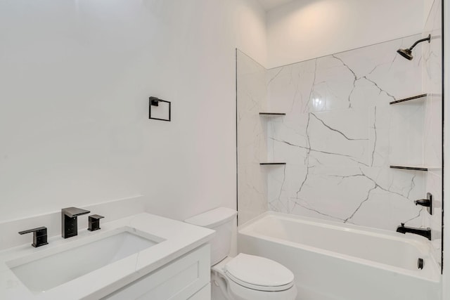 full bathroom with tiled shower / bath, vanity, and toilet