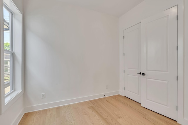 unfurnished room featuring light hardwood / wood-style floors