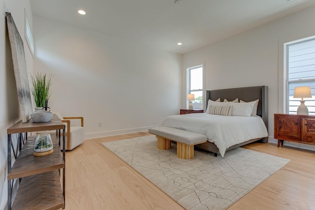 bedroom with light hardwood / wood-style floors